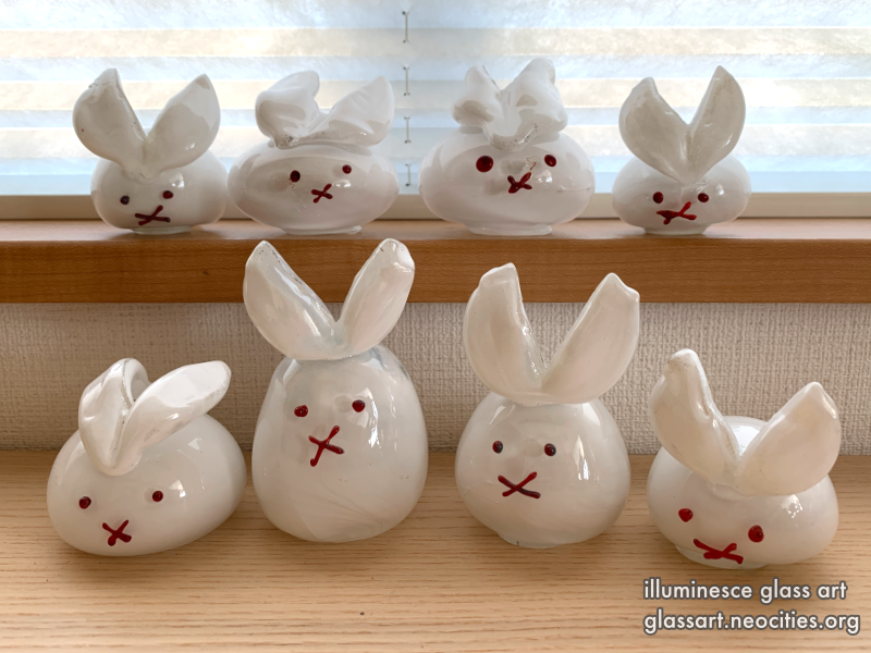 Four opaque white rabbits.